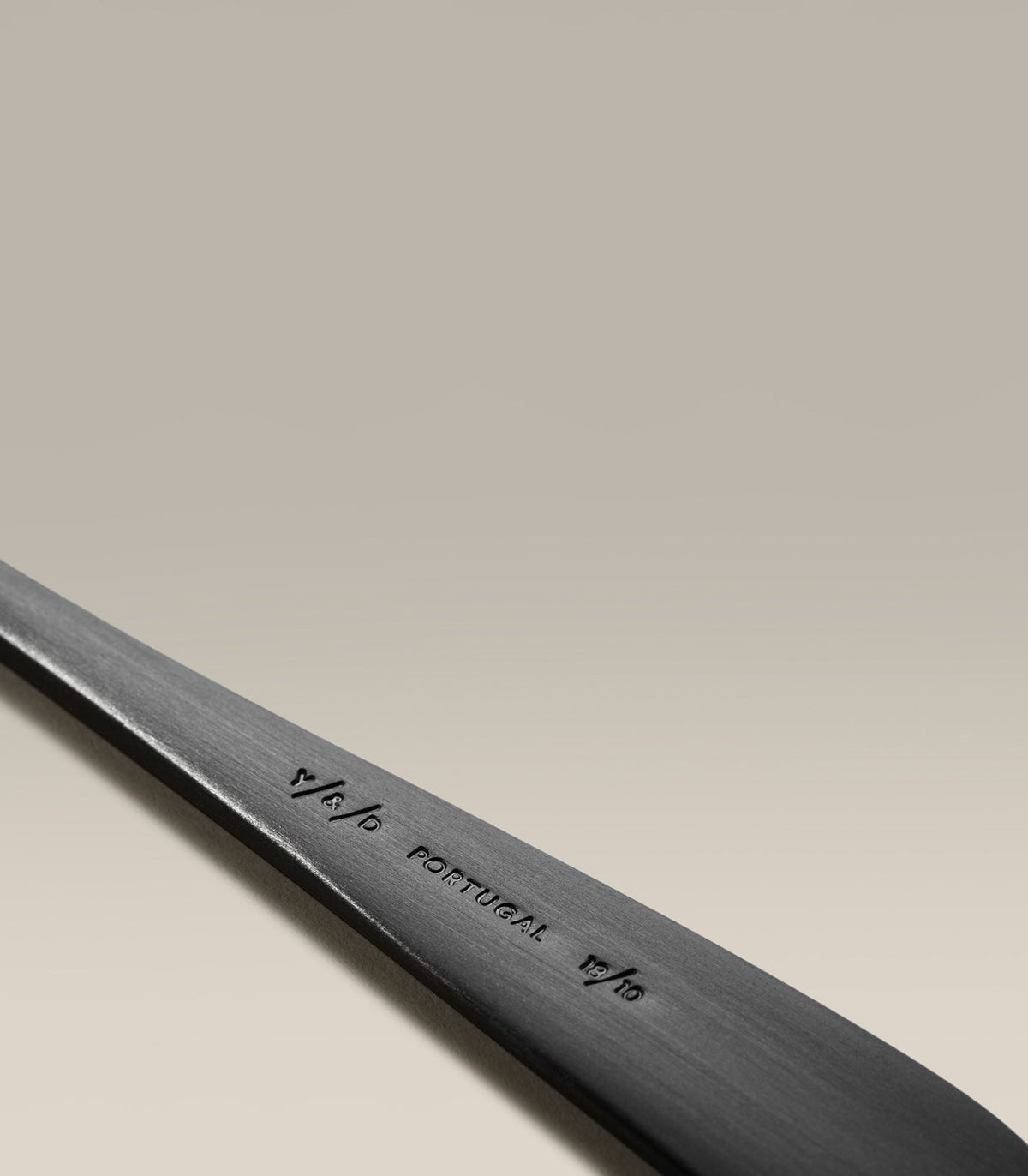 Classic Four-Person Settings Flatware Set, second held in hand for scale