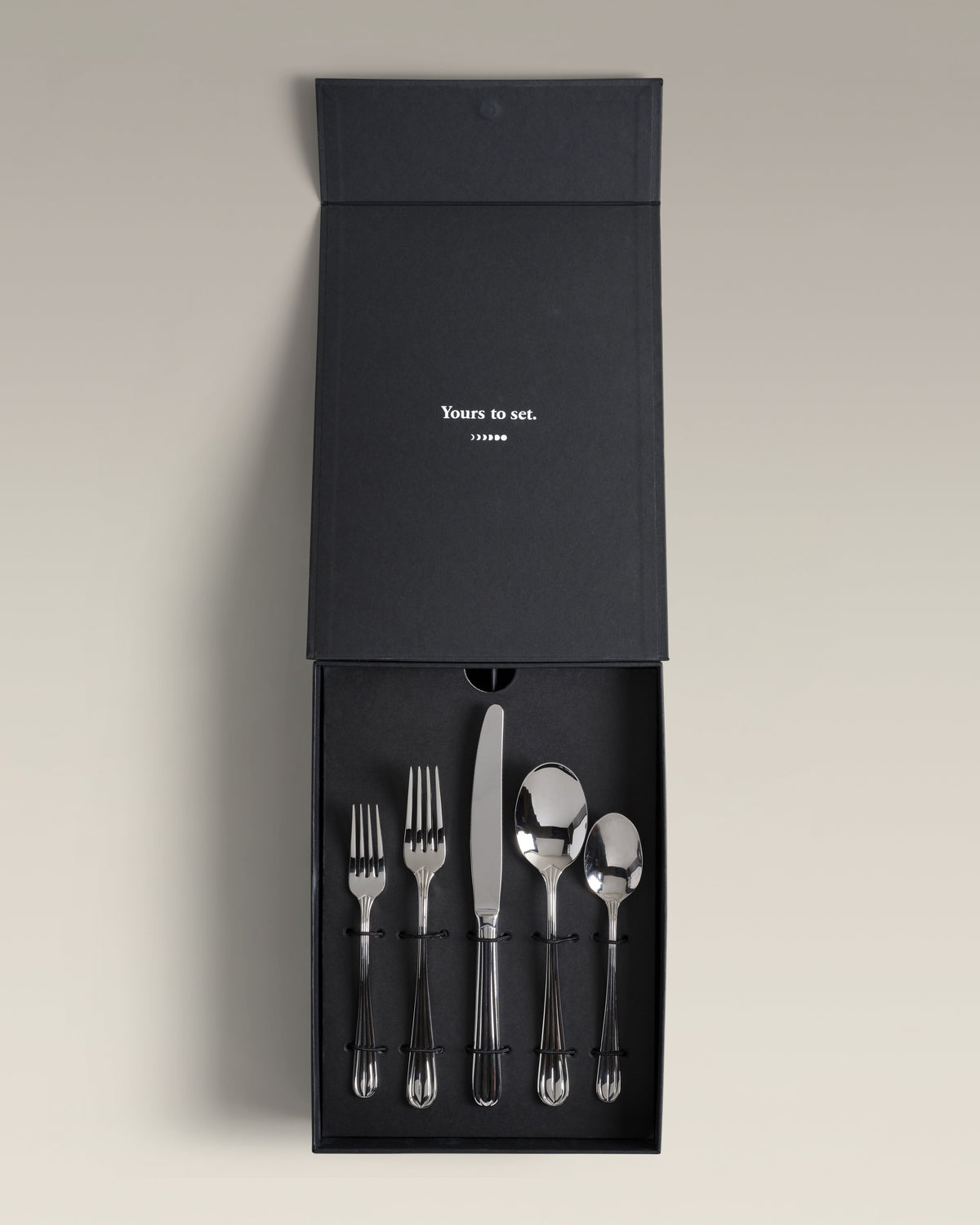 Crescent Four-Person Settings Flatware Set, two pieces side by side