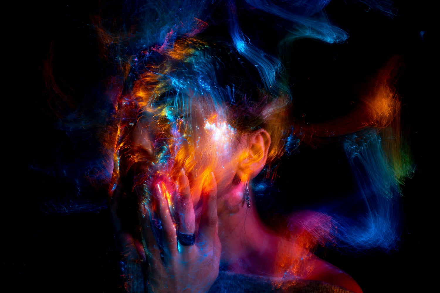 Abstract art with colorful smoke or fog effect on a dark background
